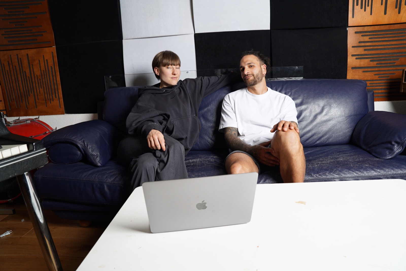 Two producers on a studio couch
